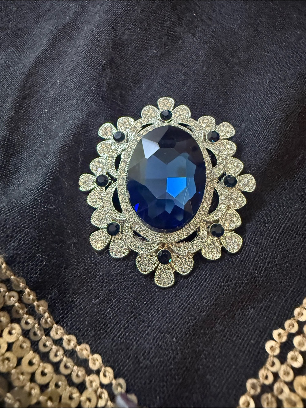 Gold-Tone Brooch with Deep Blue Faceted Glass Stone